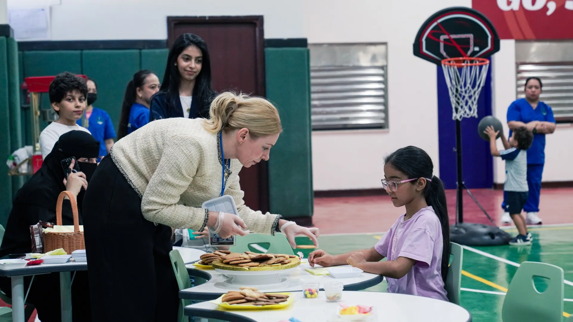 Students and families together at an AISY community event